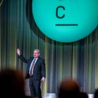 Dr. Paul Isely on stage at the West Michigan Economics Forecast